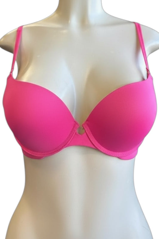 Pink bra on a mannequin against a white background