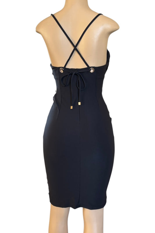 Black dress with criss-cross back on a mannequin against a white background
