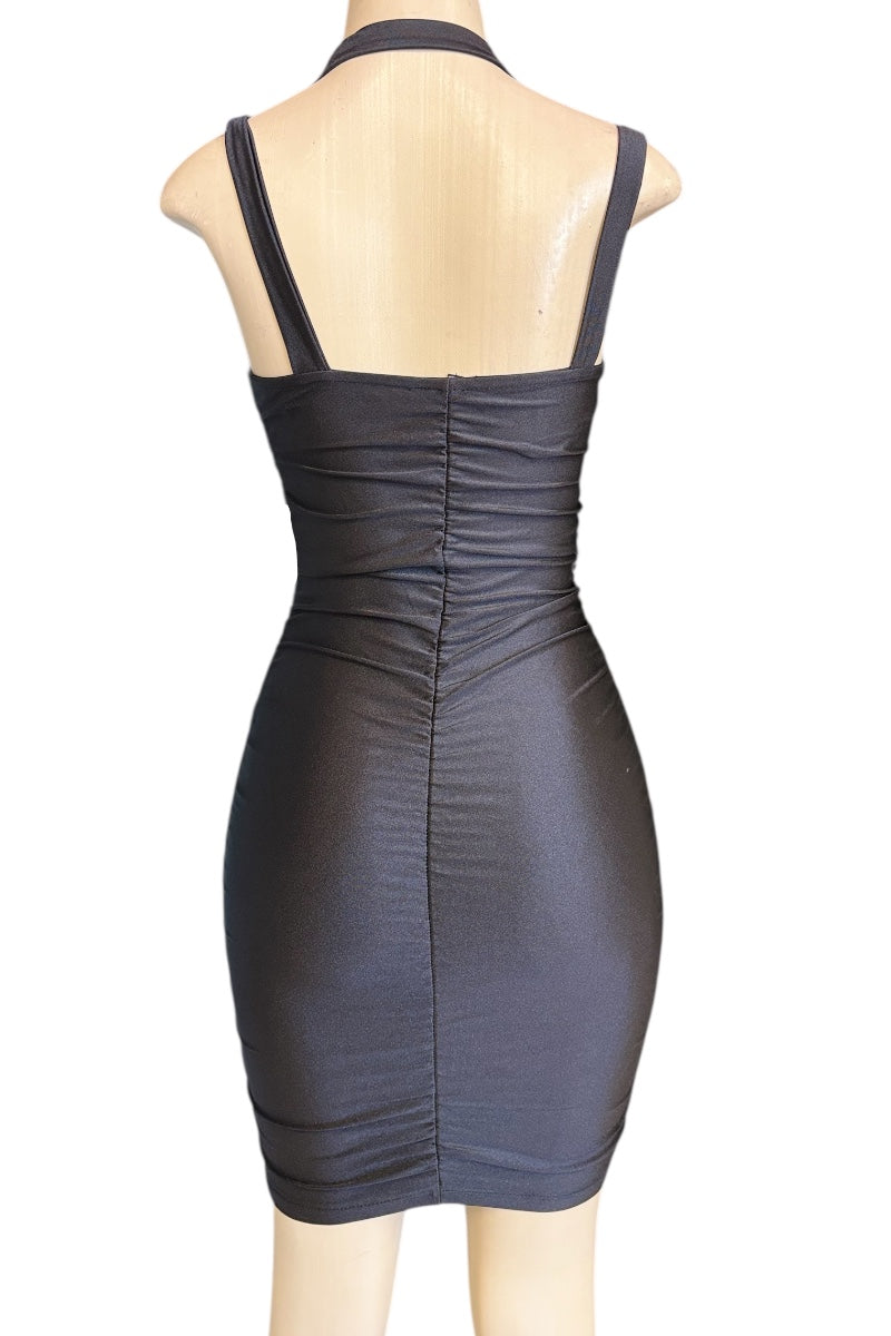Black dress on a mannequin against a white background