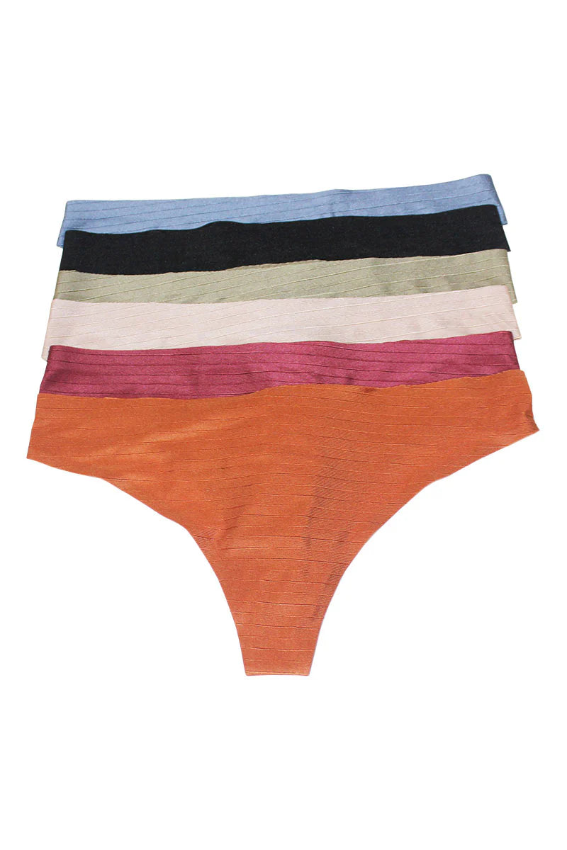 Stack of colorful women's underwear on a white background
