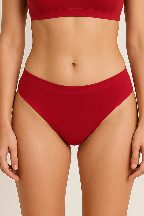 Red bikini bottom worn by a person on a neutral background