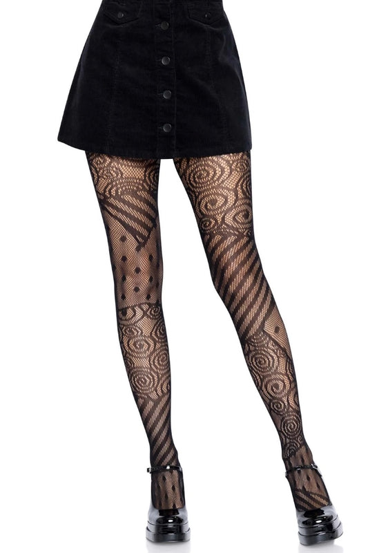 Black patterned tights with spiral and dotted motifs, worn with a black corduroy mini skirt and black platform heels against a white background.