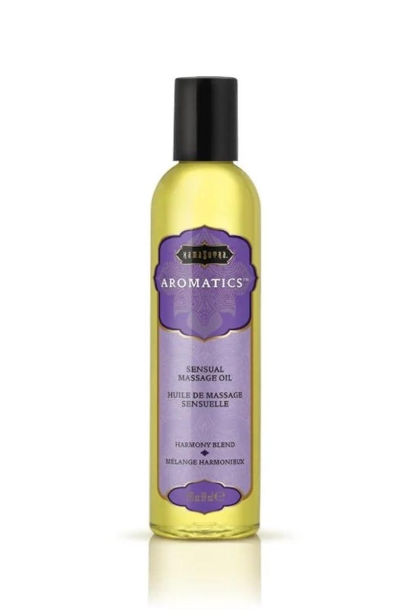 Bottle of Aromatics massage oil on a white background