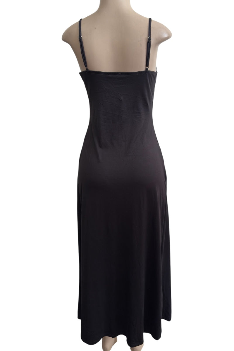 Black dress on a mannequin against a white background