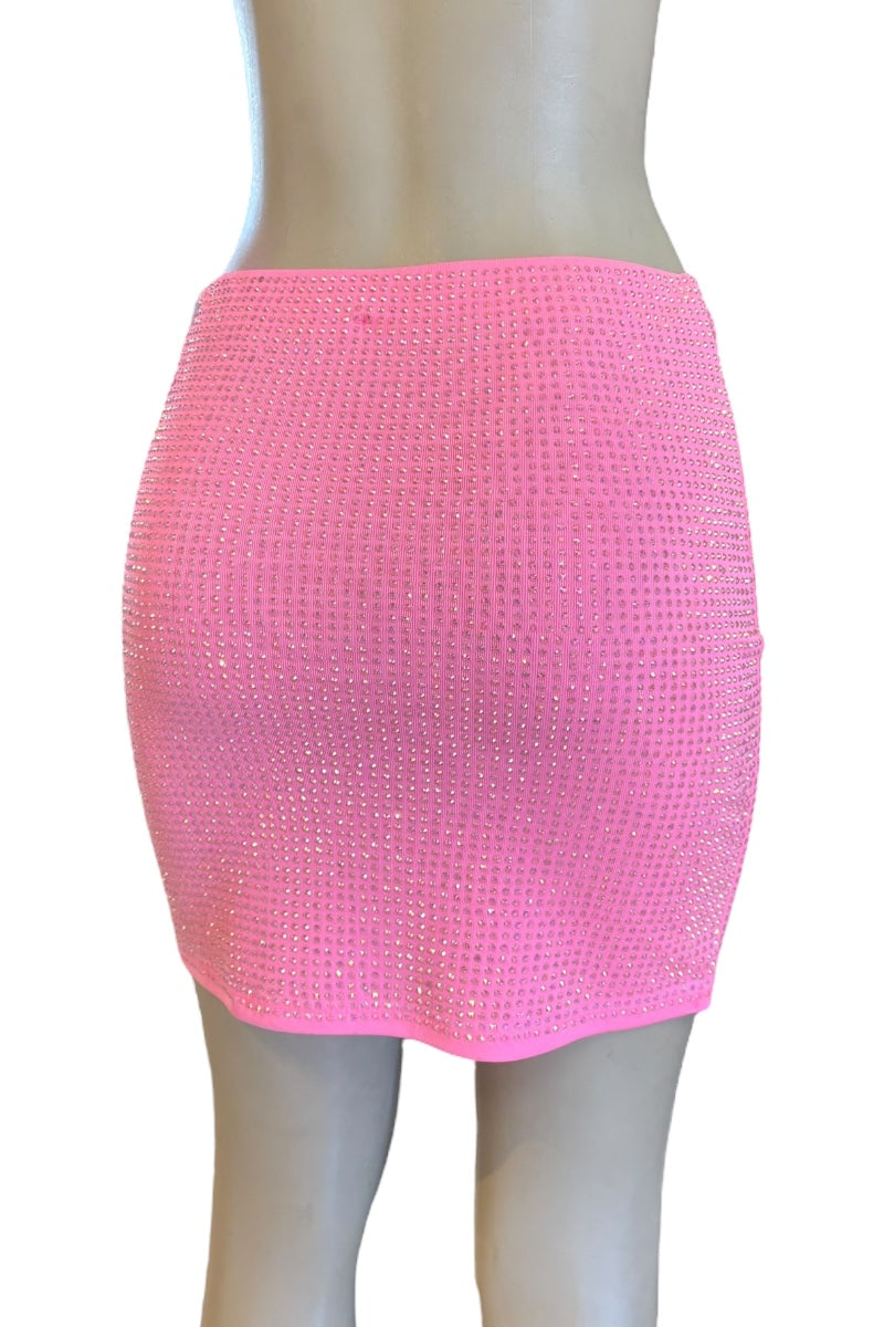 Pink studded skirt on a mannequin against a white background