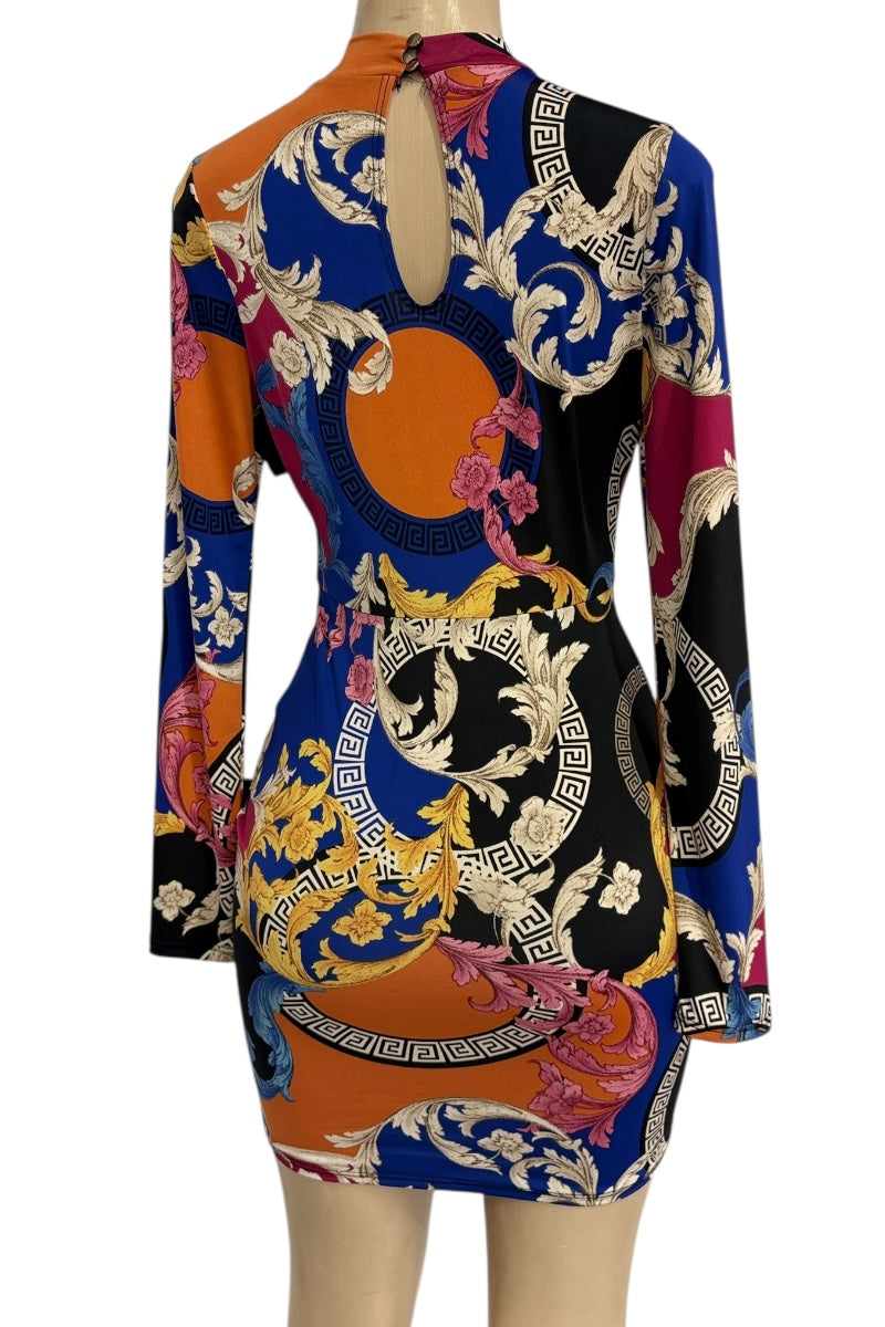 Colorful patterned dress on a mannequin against a white background