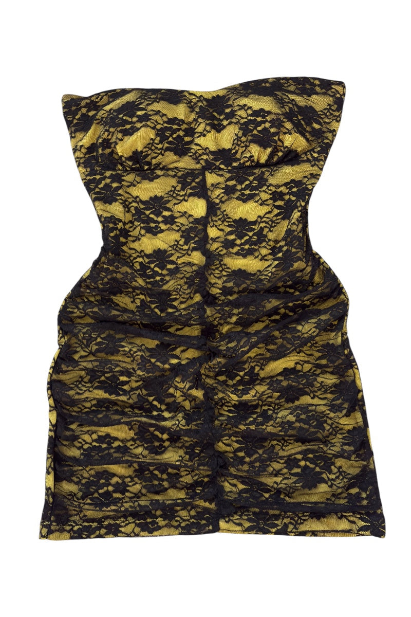 Black and yellow patterned dress on a white background