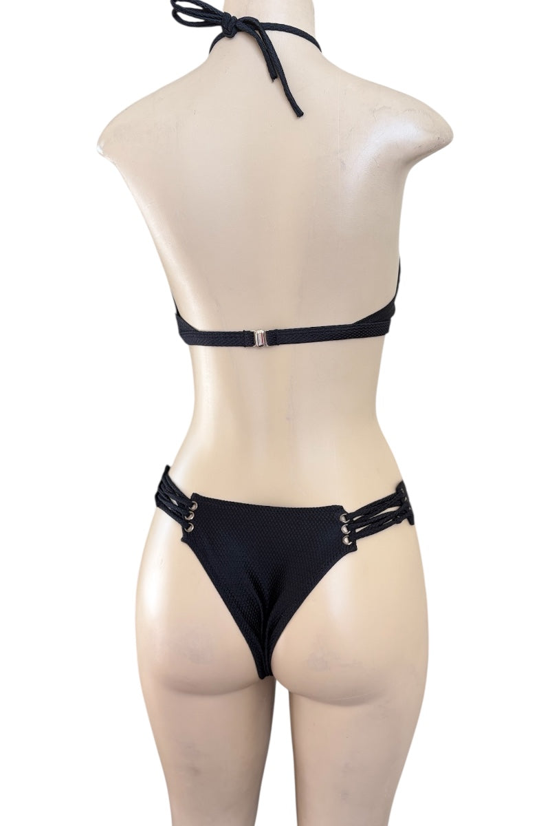 Black bikini set on a mannequin against a white background
