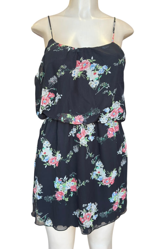 Floral dress on a mannequin against a white background