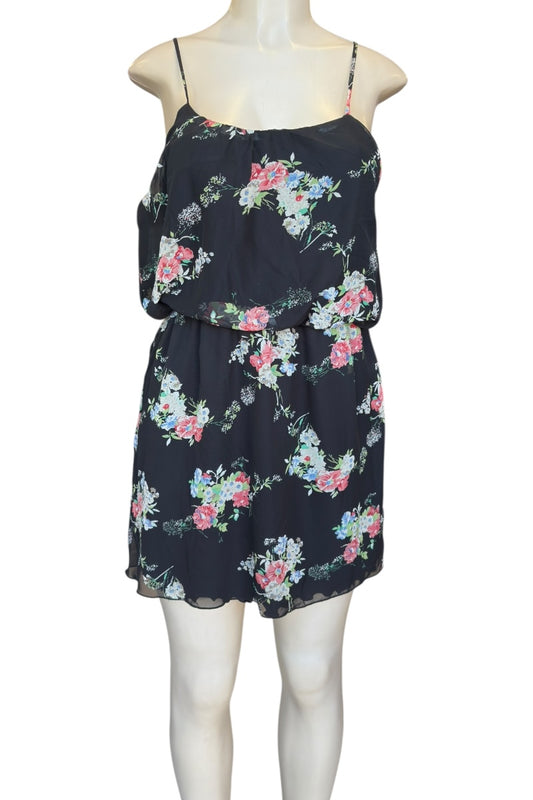 Black floral dress on a mannequin against a white background