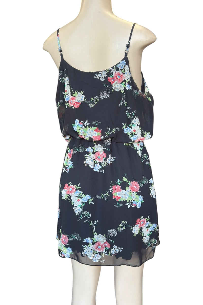 Floral dress on a mannequin against a white background