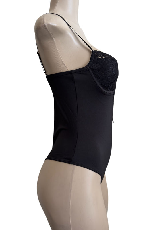 Black bodysuit with sheer panels on a mannequin against a white background