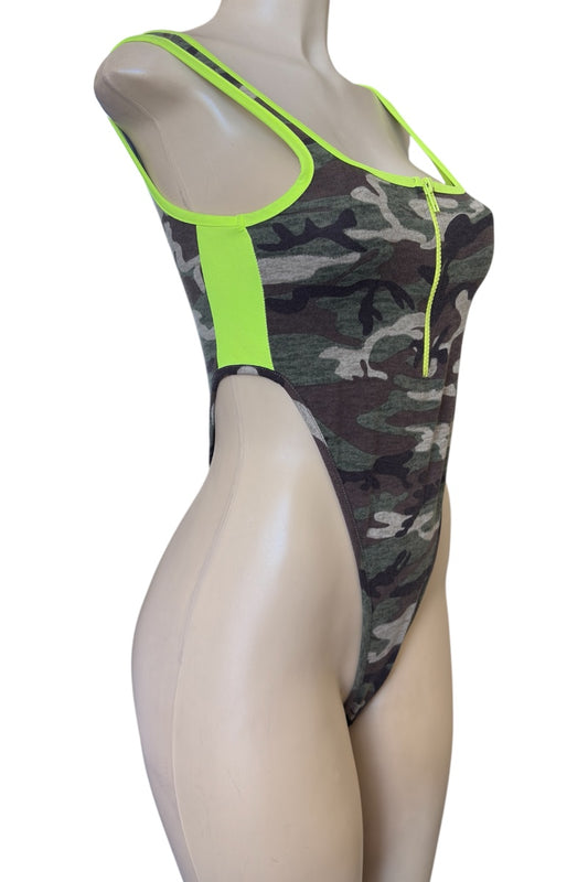 Camouflage bodysuit with neon green accents on a mannequin against a white background