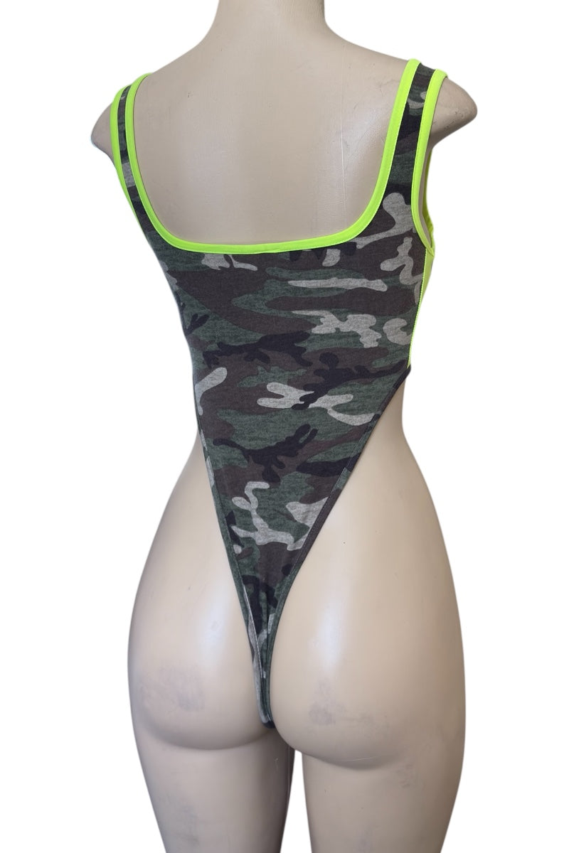 Camouflage bodysuit with green trim on a mannequin against a white background