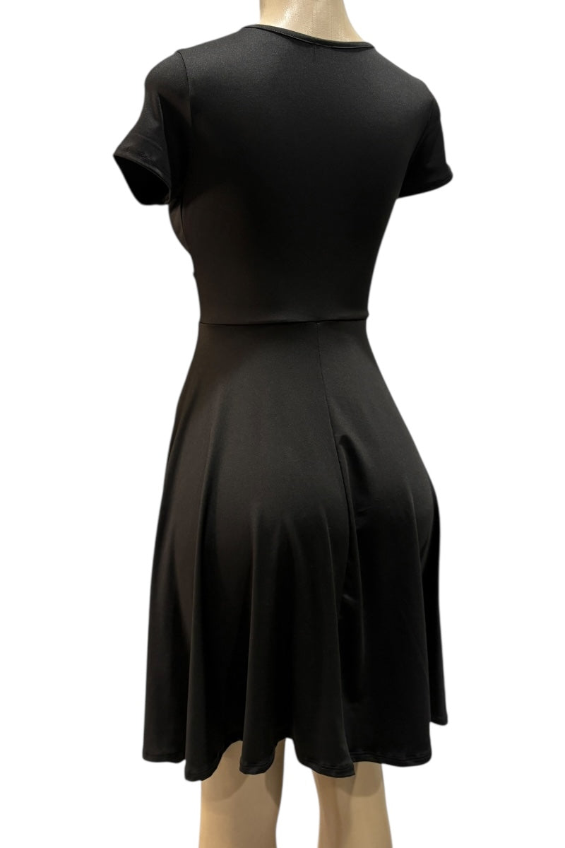 Black dress on a mannequin against a white background