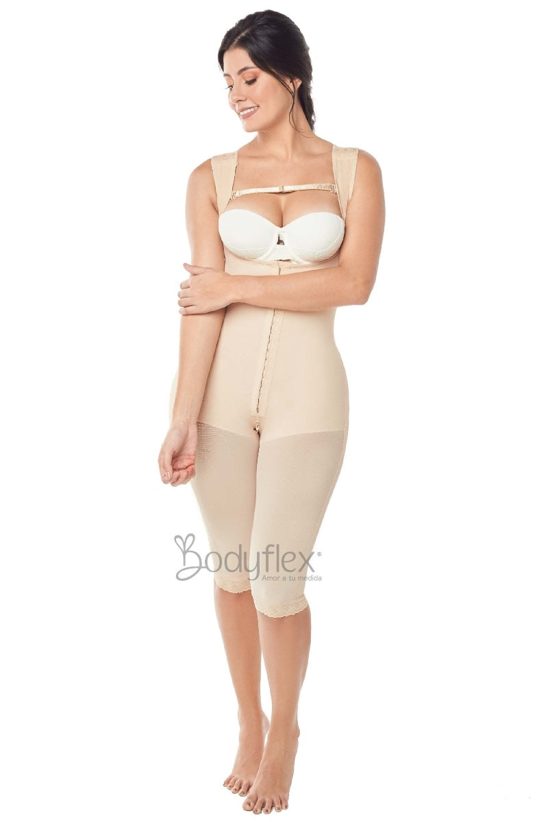 Woman wearing a beige bodysuit on a white background with 'Bodyleft' branding.