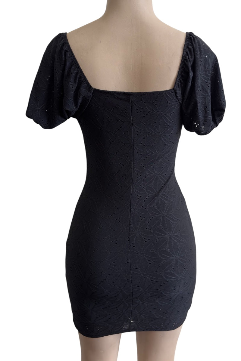 Black dress with puff sleeves on a mannequin against a white background