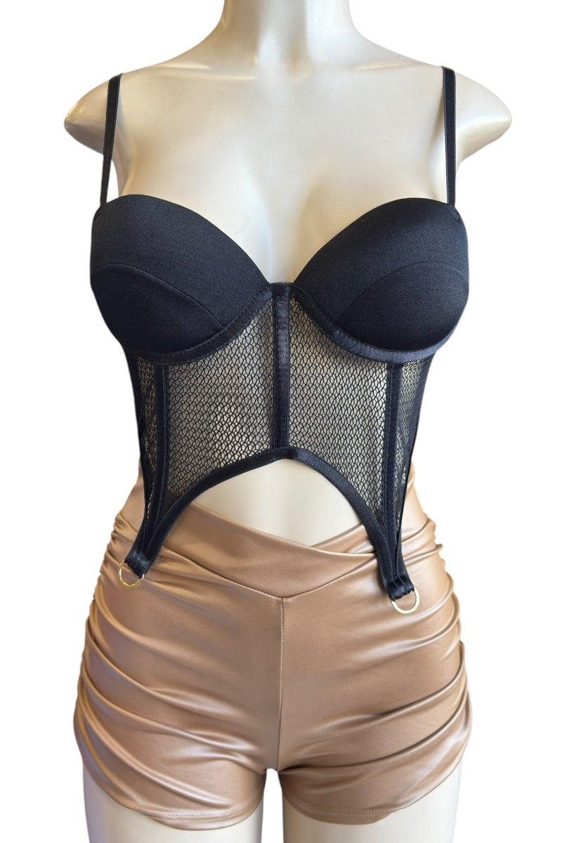 Black mesh crop top with beige shorts on a mannequin against a white background