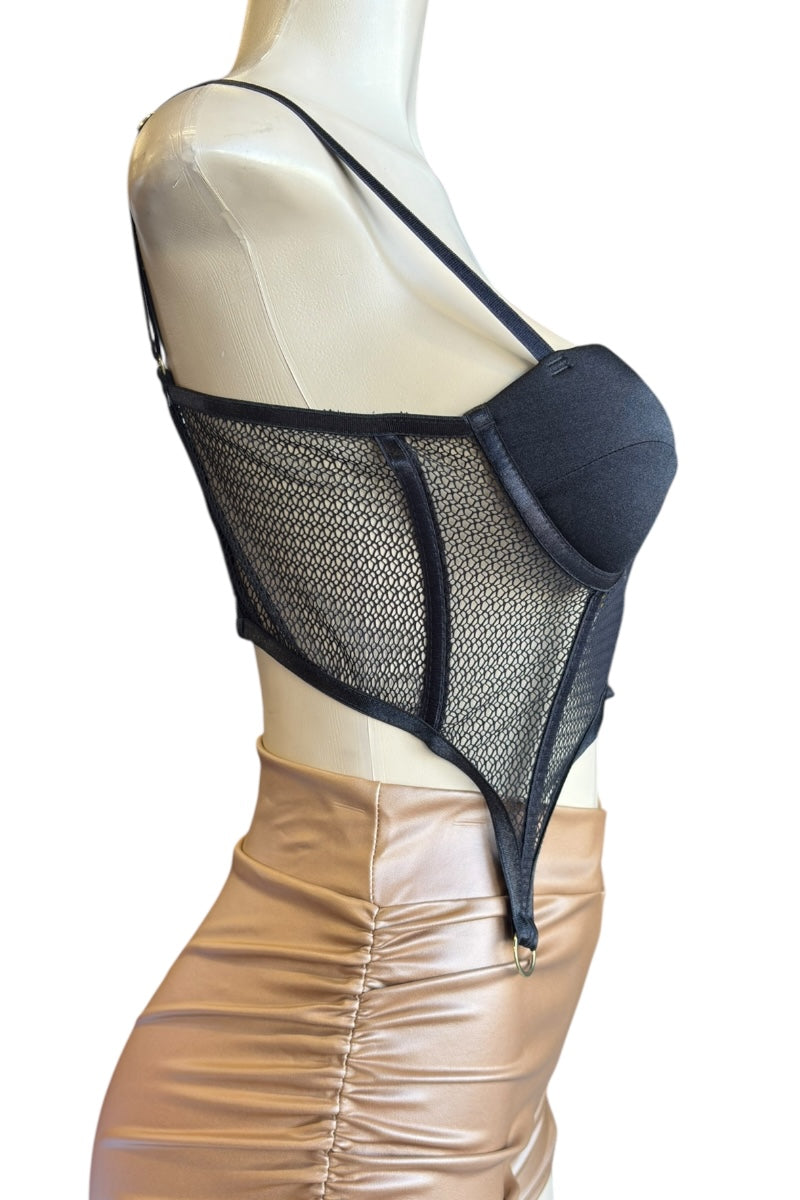 Black mesh top on a mannequin against a white background