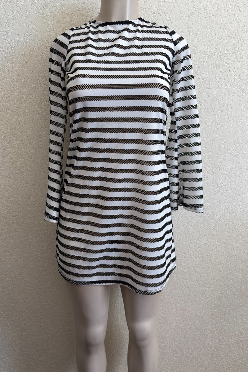 Black and white striped dress on a mannequin against a plain background