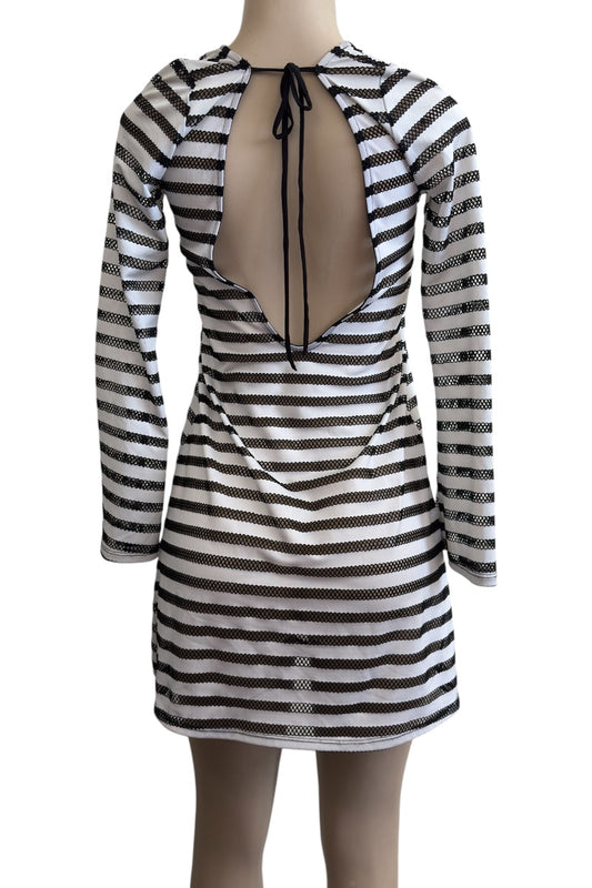 Black and white striped dress with sheer back on a mannequin against a white background