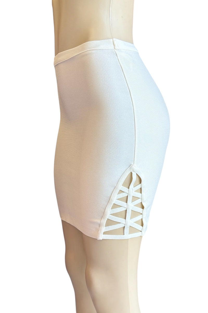 cream skirt with open detailing on a mannequin against a white background