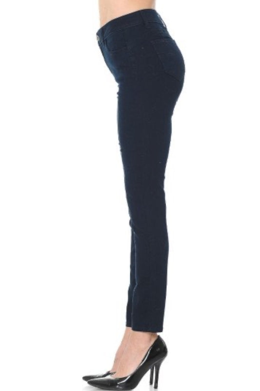 Black jeans worn by a person on a white background