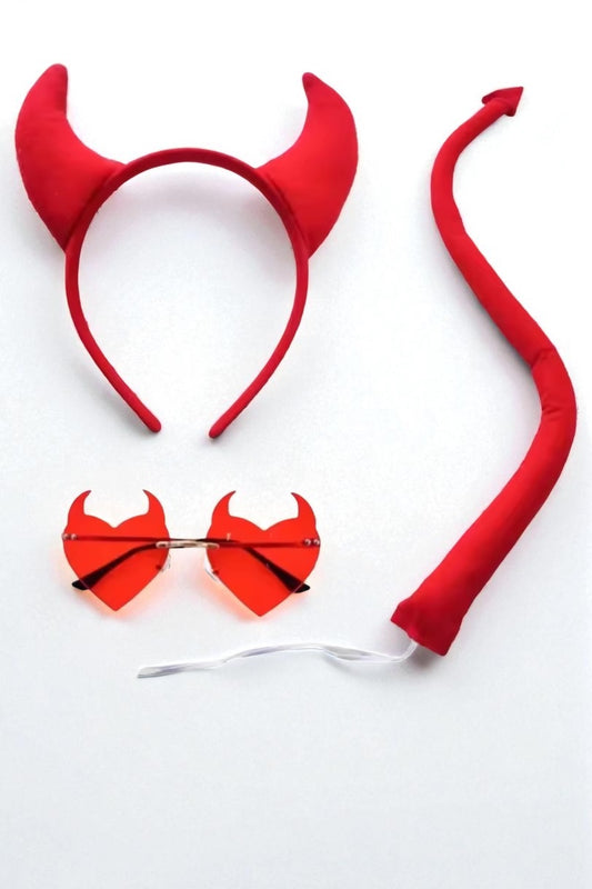 Red devil horn headband, tail, and sunglasses on a white background