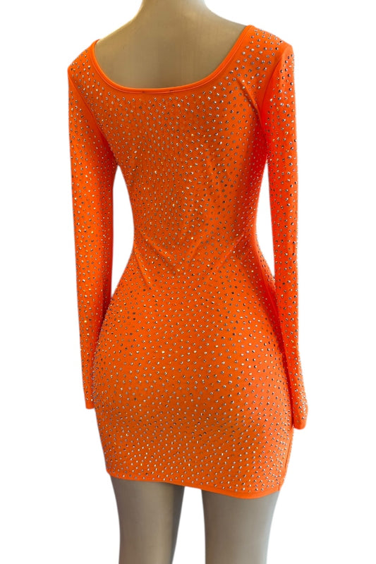 Orange dress with rhinestone embellishments on a white background