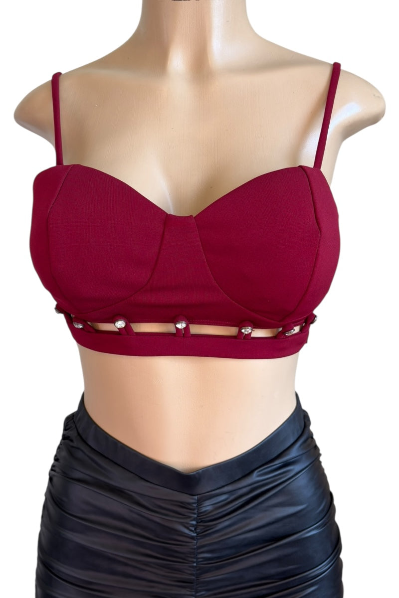Burgundy bralette with cut-out design on a mannequin against a white background