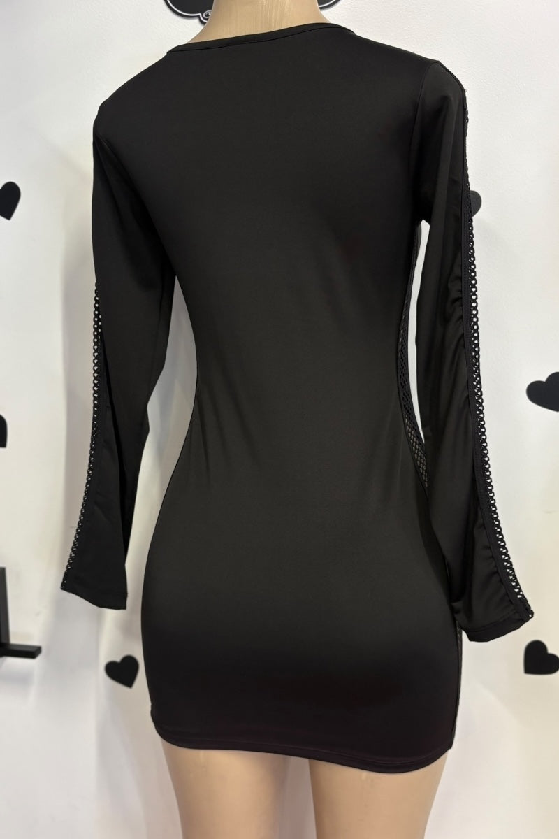 Black long-sleeve dress with lace details on a mannequin against a white background