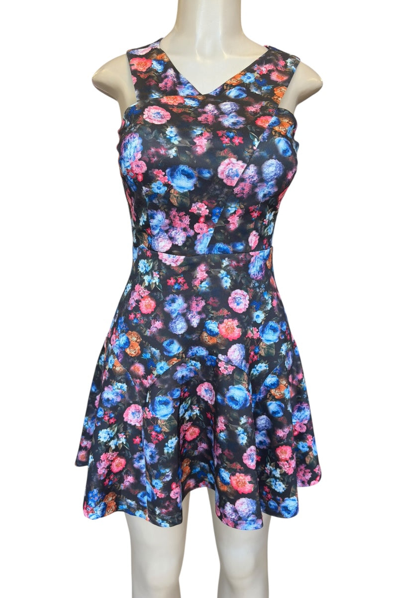 Floral dress on a mannequin against a white background