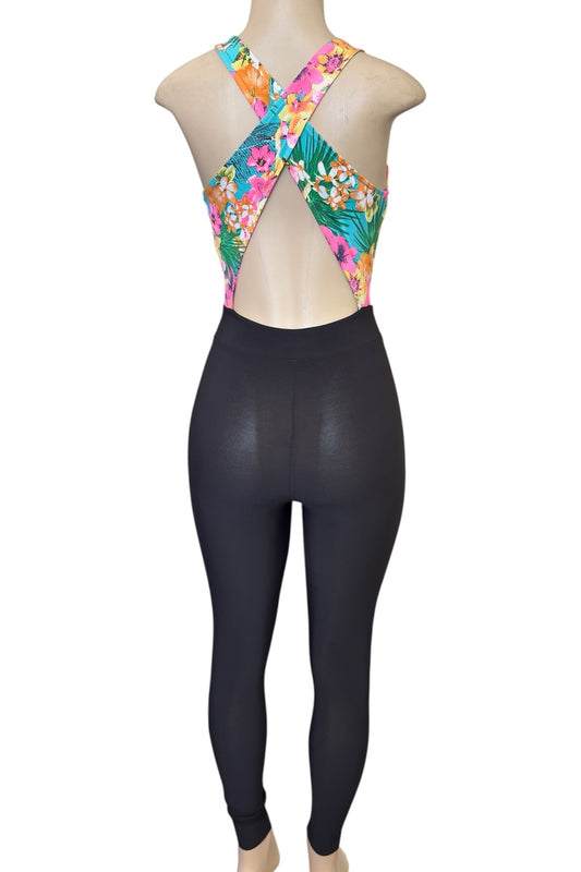Mannequin wearing a colorful floral jumpsuit on a white background