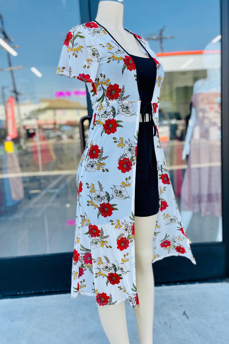 Floral cardigan on a mannequin in front of a store window