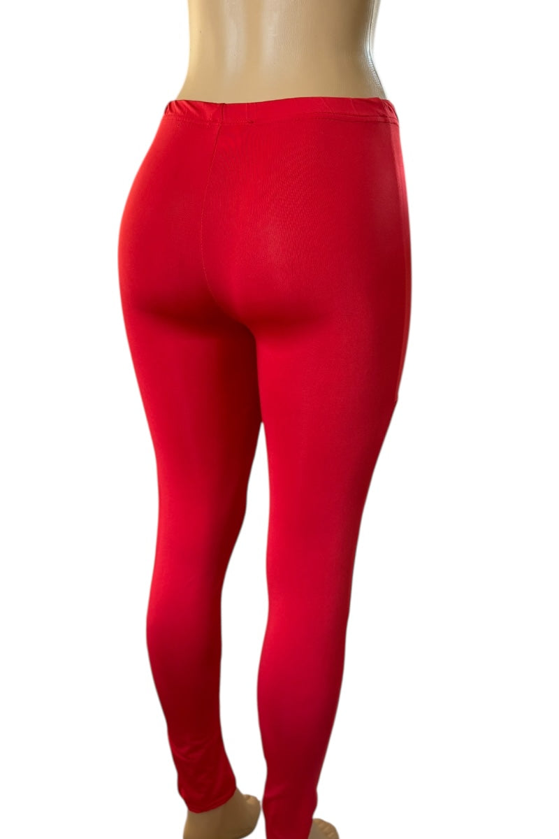 Red leggings on a mannequin against a white background