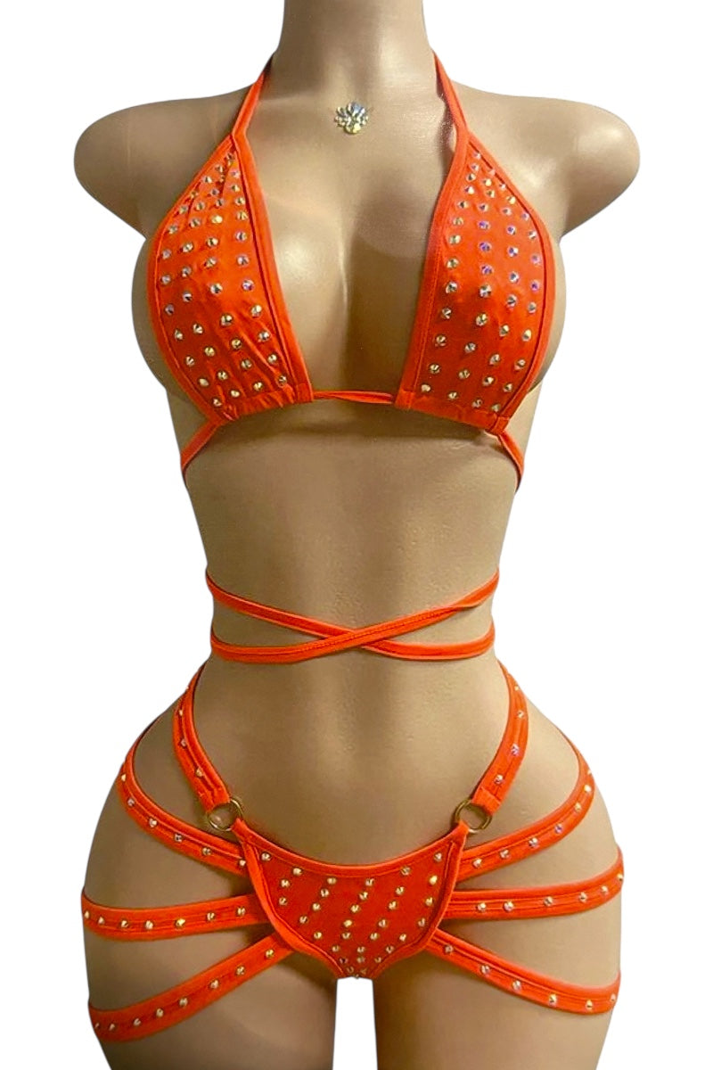 Orange bikini set with rhinestone details on a mannequin against a white background