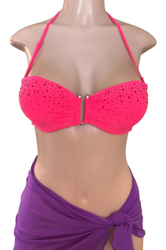 Coral bikini top on a mannequin with a purple sarong