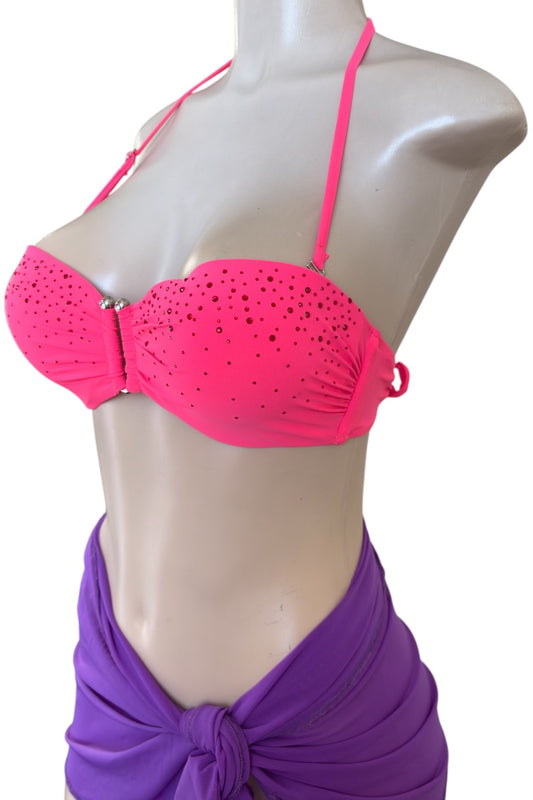 Coral bikini top on a mannequin with a purple sarong