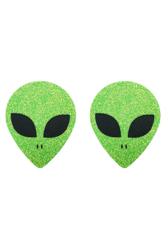 Pair of green alien-shaped pasties on a white background