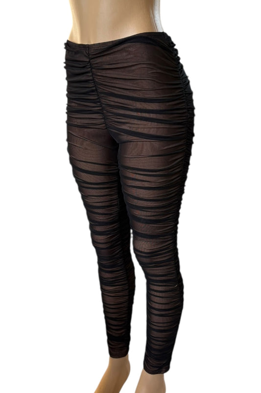 Black ruched leggings on a white background