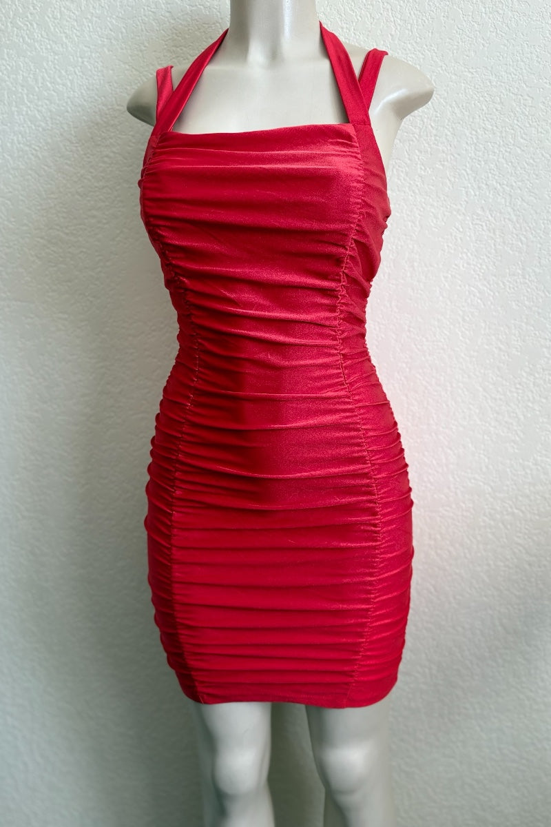 Red dress on a mannequin against a white background