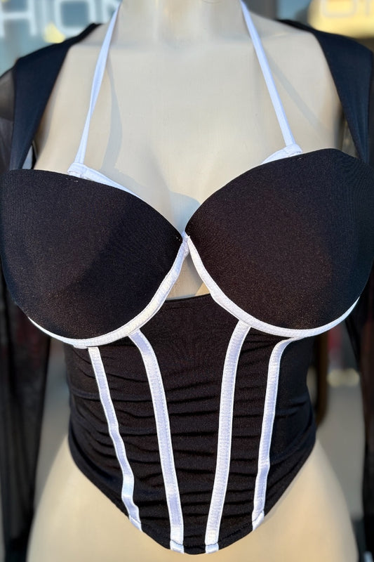 Black and white top on a mannequin with blurred background
