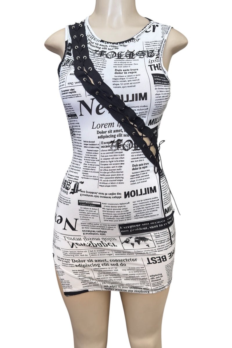 Dress with newspaper print on a mannequin against a white background