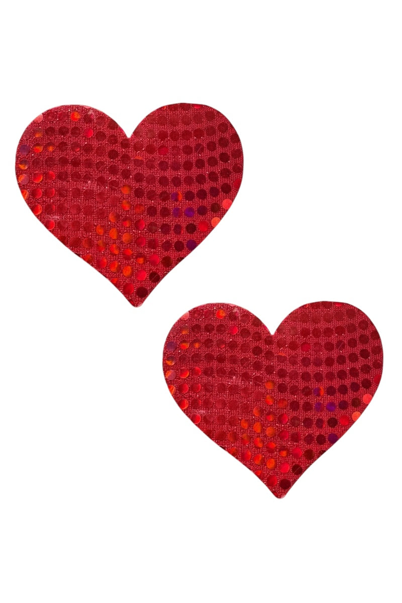 Two red heart-shaped pasties with a glittery texture on a white background