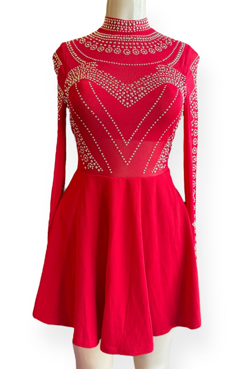 Red dress with intricate embellishments on a white background