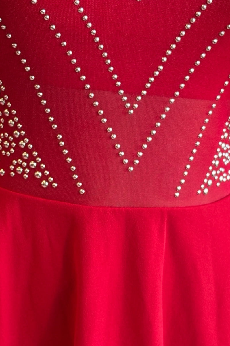 Red dress with bead embellishments on a plain background