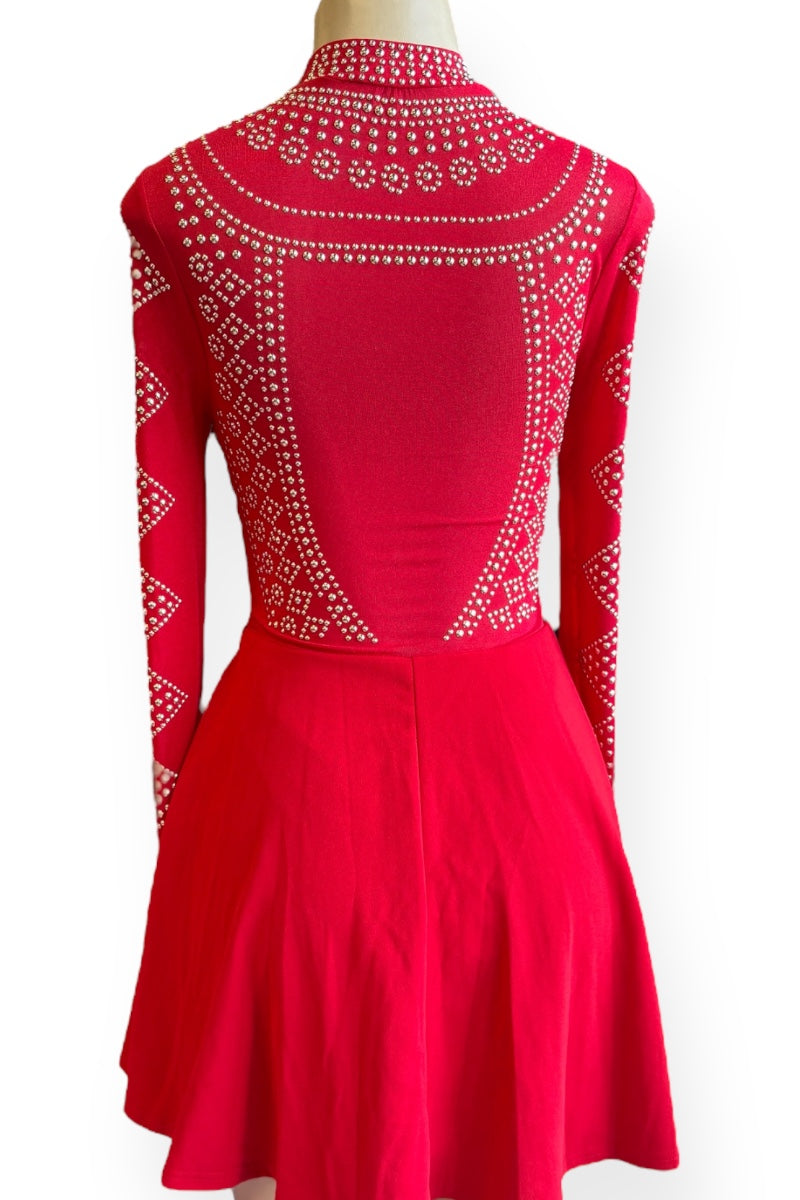 Red dress with intricate pattern on a white background