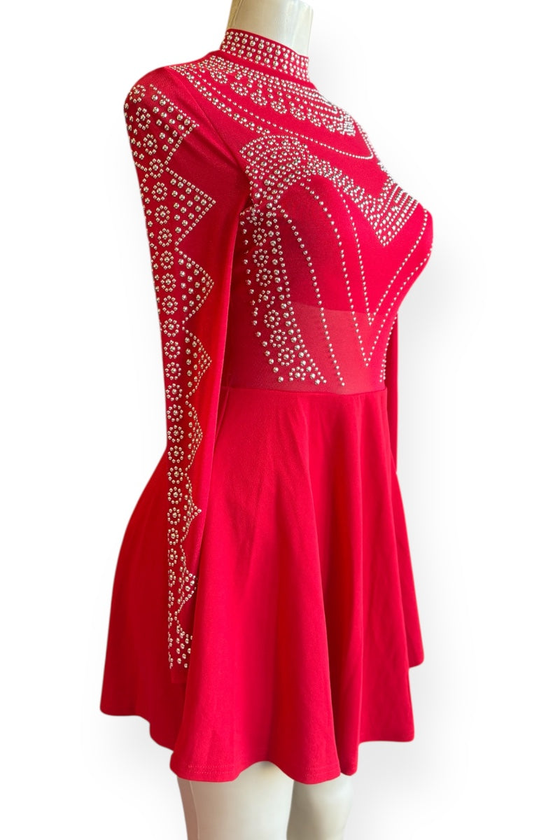 Red dress with embellishments on a mannequin against a white background
