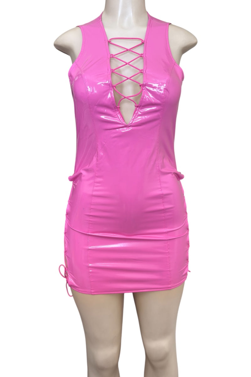 Pink dress with lace-up front on a mannequin against a white background