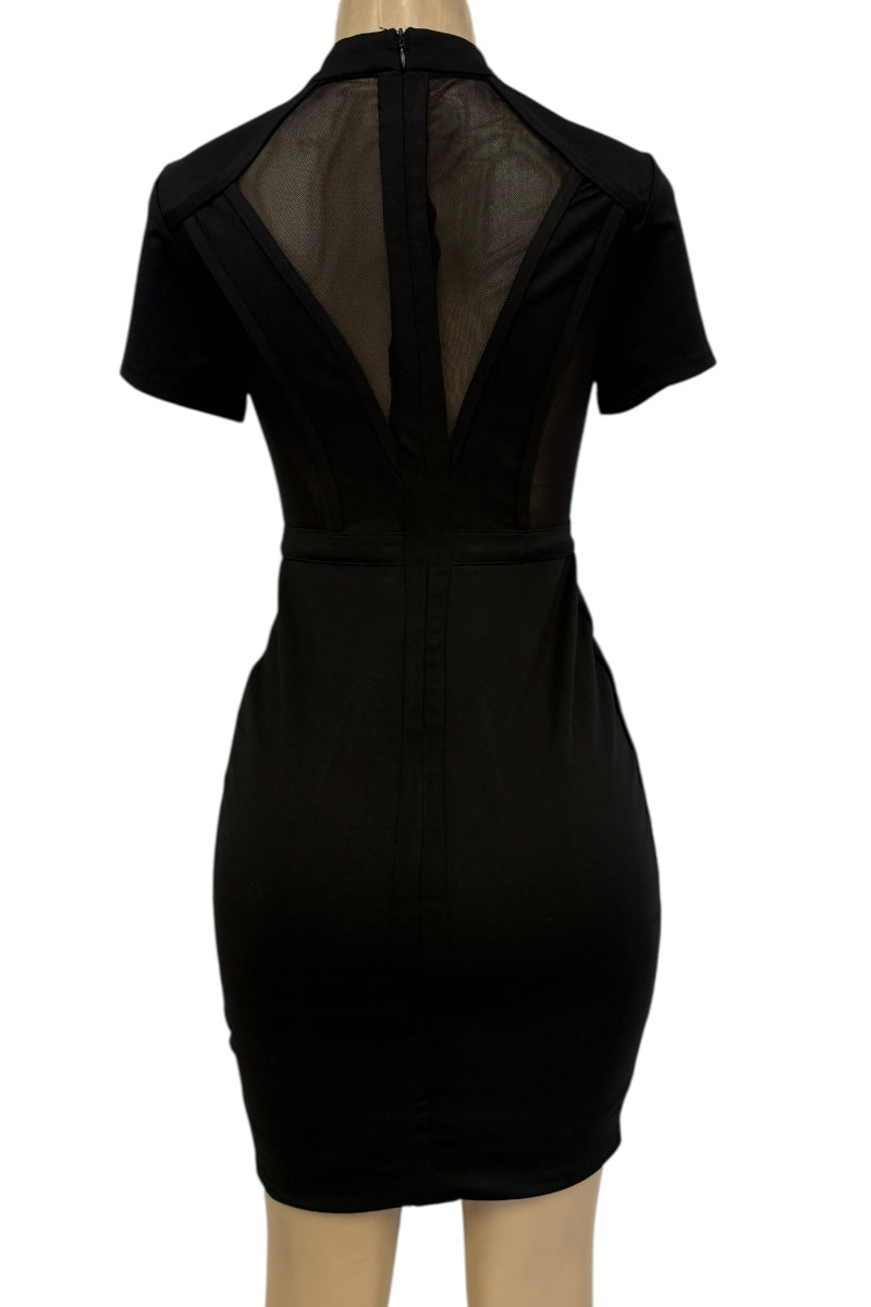 Black dress with sheer back on a mannequin against a white background